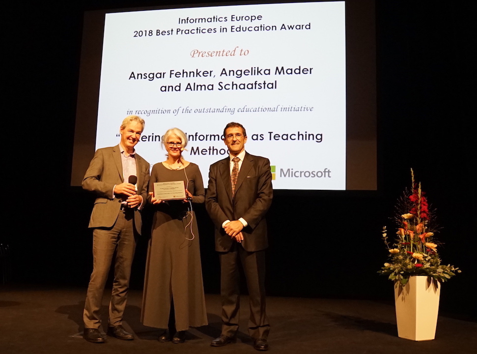 Angelika Mader (Winner of 2018 Best Practices in Education Award) with Michael Kölling (Award Chair) and Enrico Nardelli (Informatics Europe President).